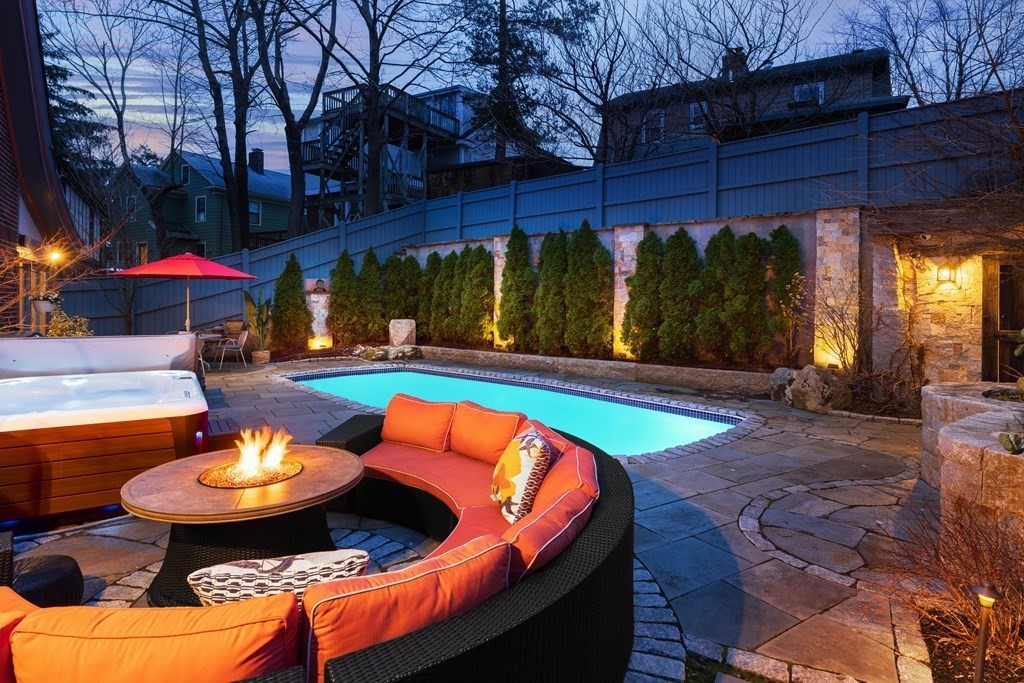 24 Jordan Road Brookline, MA 02446 - Photo 2 of 27 a view of a swimming pool with a patio