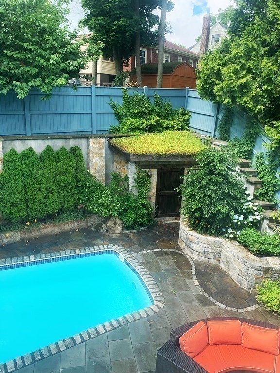24 Jordan Road Brookline, MA 02446 - Photo 24 of 27 a view of a backyard with a patio