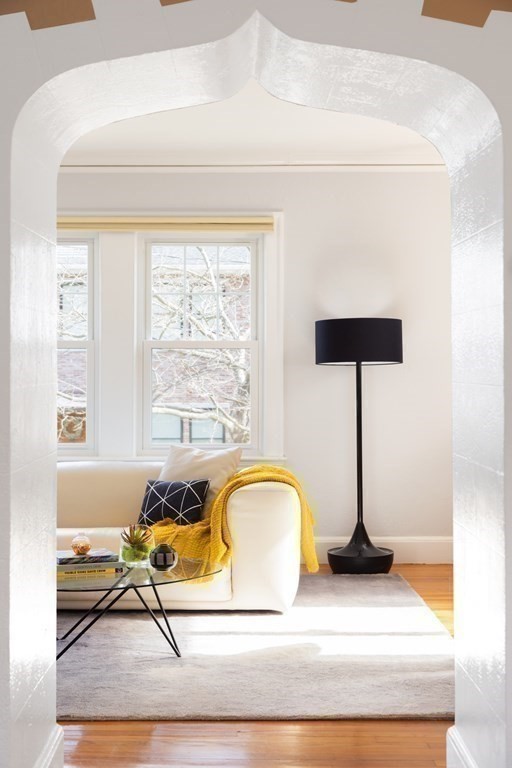 24 Jordan Road Brookline, MA 02446 - Photo 7 of 27 a living room with a table and window