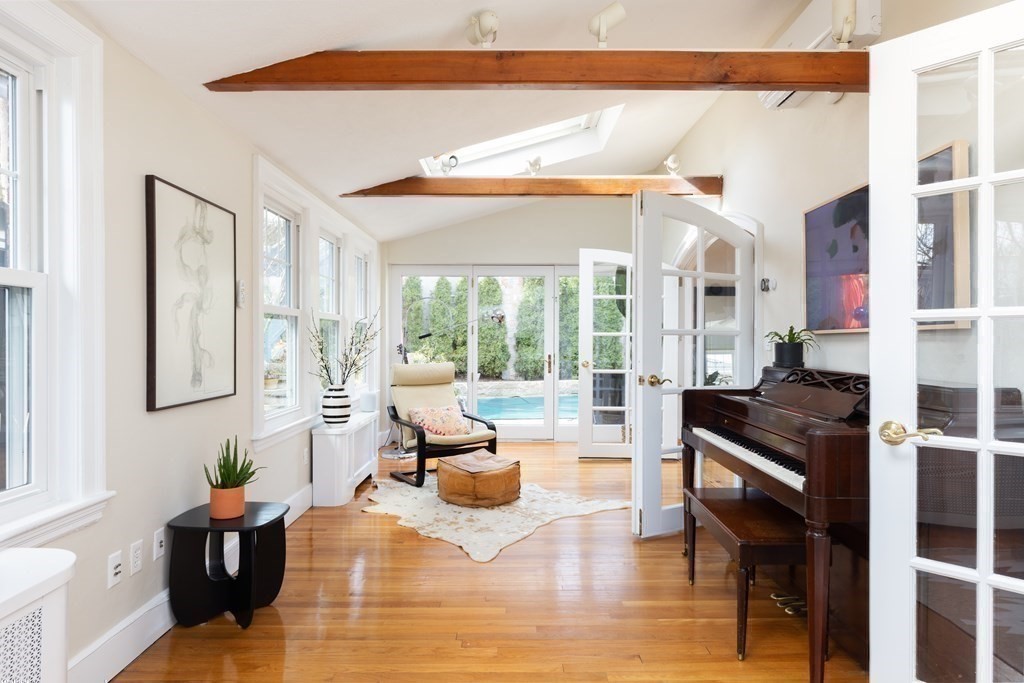 24 Jordan Road Brookline, MA 02446 - Photo 9 of 27 a living room with furniture and a fireplace