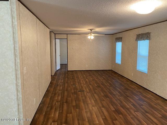 54311 Heron Road Callahan, FL 32011 - Photo 30 of 36 a view of empty room with wooden floor