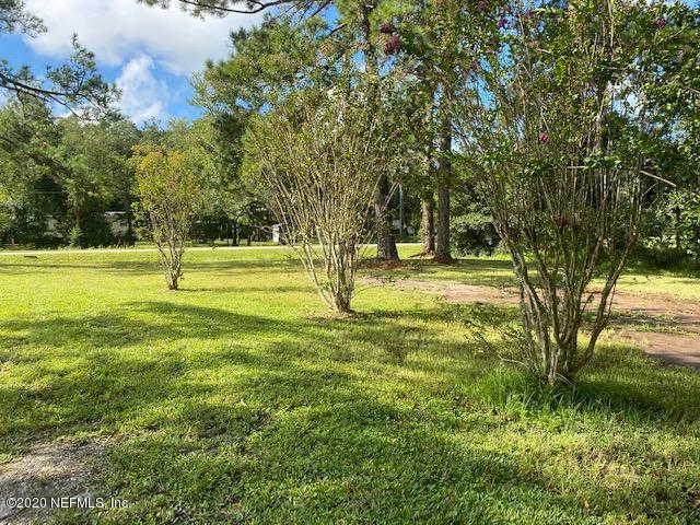 54311 Heron Road Callahan, FL 32011 - Photo 3 of 36 a big yard with lots of green space and trees
