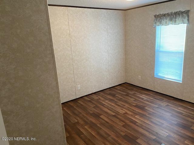 54311 Heron Road Callahan, FL 32011 - Photo 35 of 36 a view of a room with wooden floor and window
