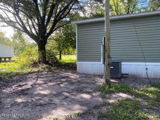 54311 Heron Road Callahan, FL 32011 - Photo 10 of 36 a view of a backyard with large trees