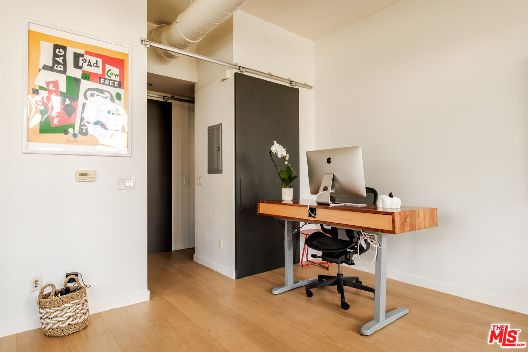 1912 Broadway, Unit 205 Santa Monica, CA 90404 - Photo 11 of 22 a view of a workspace with furniture and a window