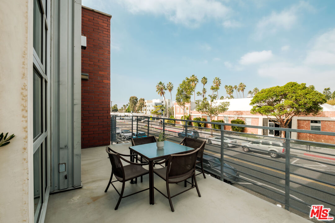 1912 Broadway, Unit 205 Santa Monica, CA 90404 - Photo 13 of 22 a balcony with furniture and a potted plant