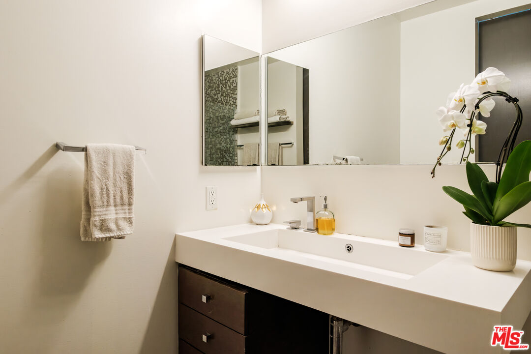 1912 Broadway, Unit 205 Santa Monica, CA 90404 - Photo 14 of 22 a bathroom with a sink and a mirror