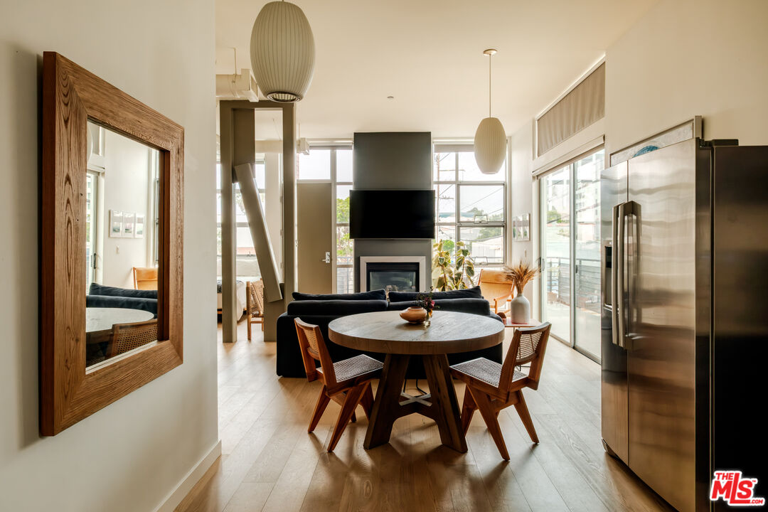 1912 Broadway, Unit 205 Santa Monica, CA 90404 - Photo 7 of 22 a view of a dining room with furniture window and outside view