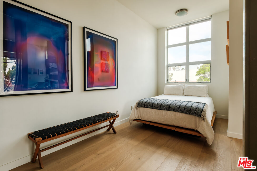 1912 Broadway, Unit 205 Santa Monica, CA 90404 - Photo 10 of 22 a bedroom with a bed and a window