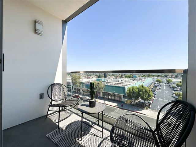 a view of a chairs and table in patio