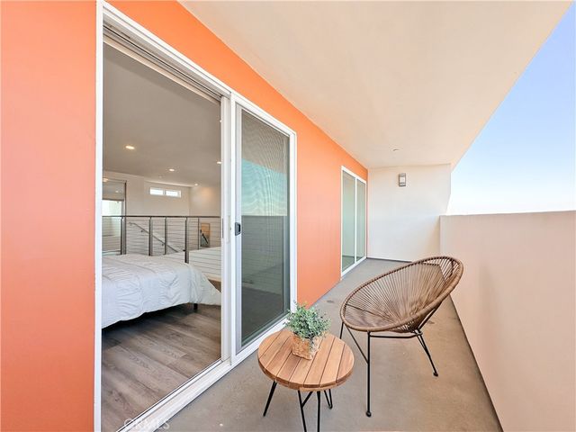 a bedroom with a bed and a painting