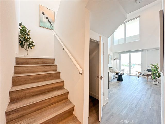 a view of entryway and workspace with wooden floor