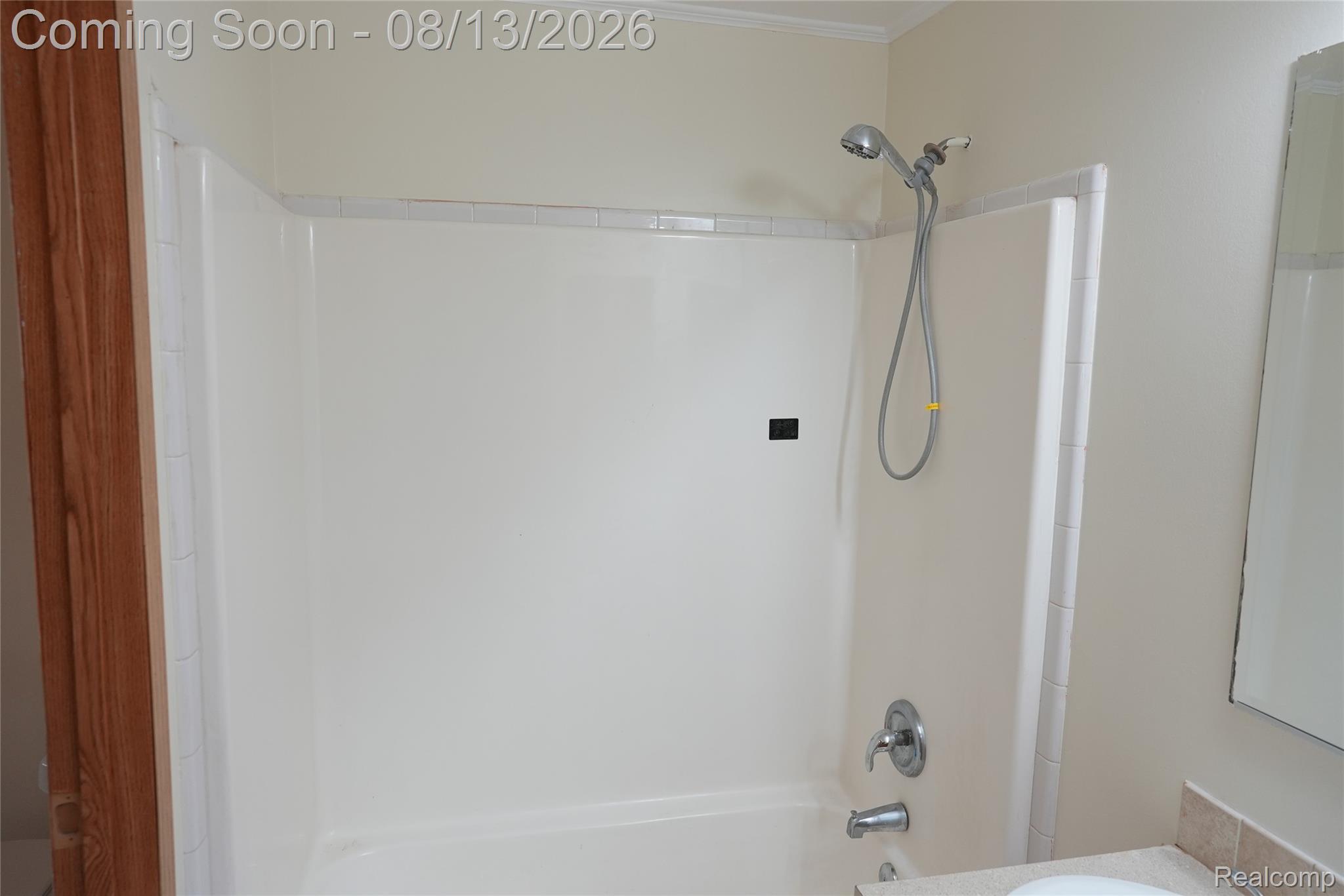 2018 John R Road Troy, MI 48083 - Photo 41 of 57 Bathtub and shower combination with a handheld shower fixture