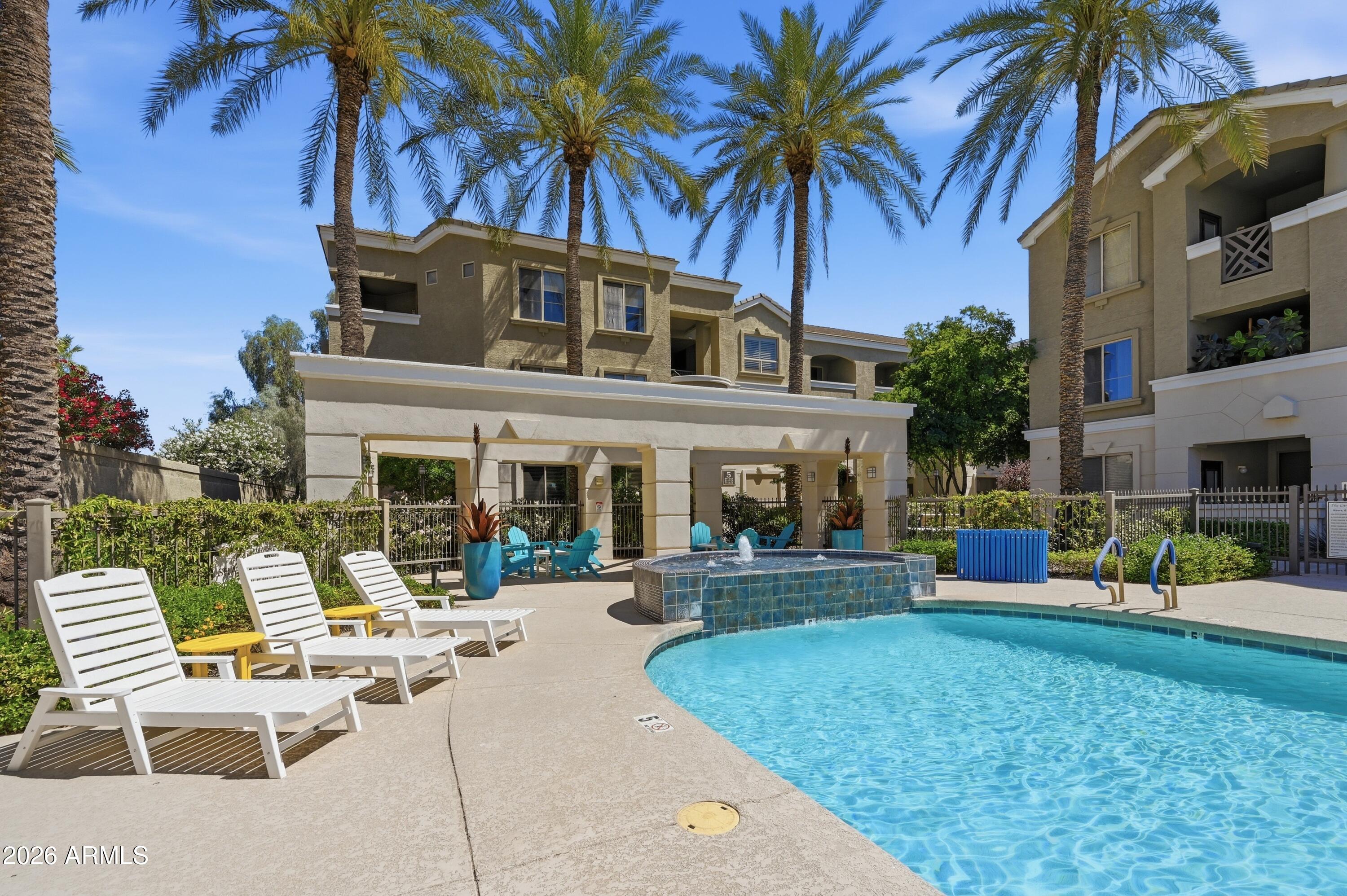 5303 North 7th Street, Unit 220 Phoenix, AZ 85014 - Photo 27 of 33 a view of a house with swimming pool and sitting area