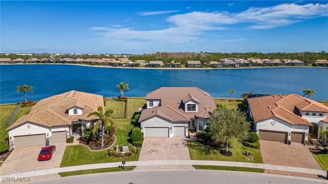 an aerial view of a house with a ocean view