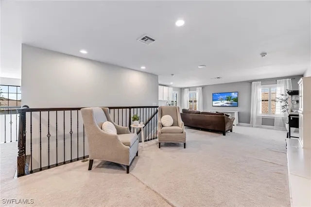 a kitchen with stainless steel appliances granite countertop a stove a sink and a white cabinets