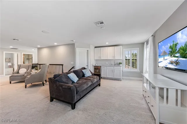 a living room with a large bed and a large window