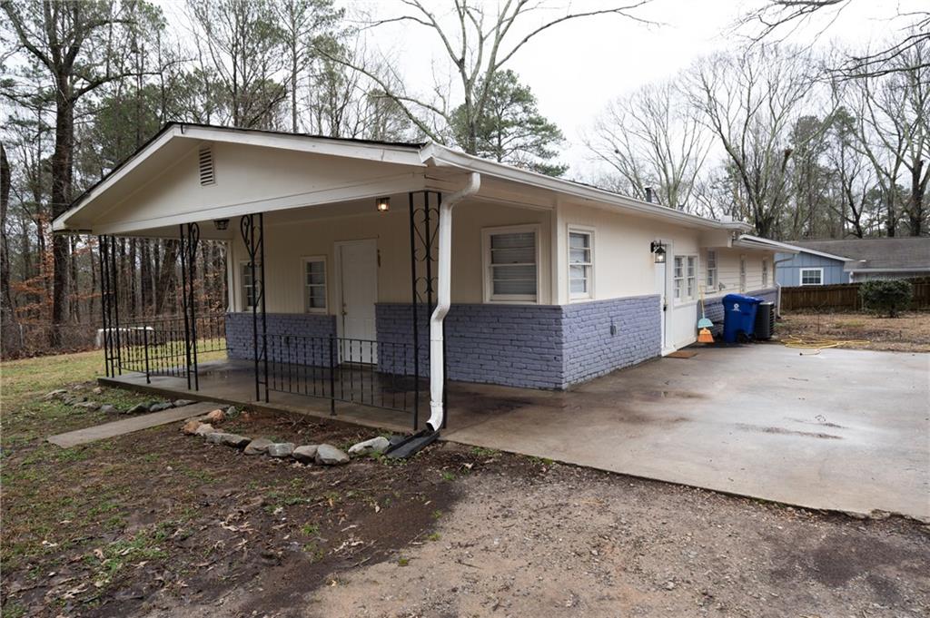 a view of a house with a yard and garage