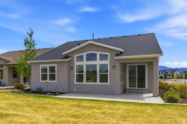 108 West Monte Rosa Lane Midway, UT 84049 - Photo 40 of 48 Rear exterior featuring a large patio, stucco siding, and a dark shingle roof
