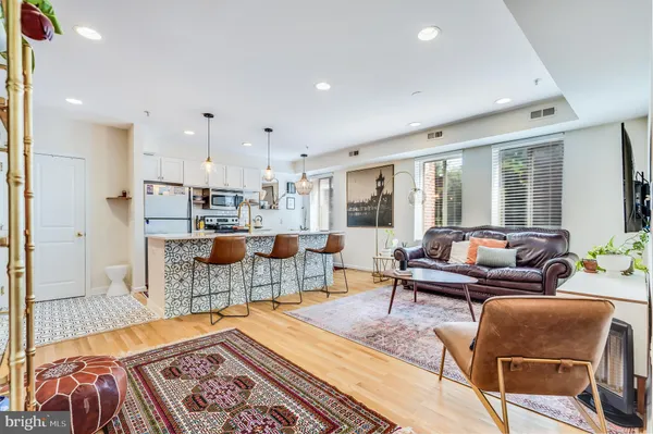 a living room with furniture and a rug