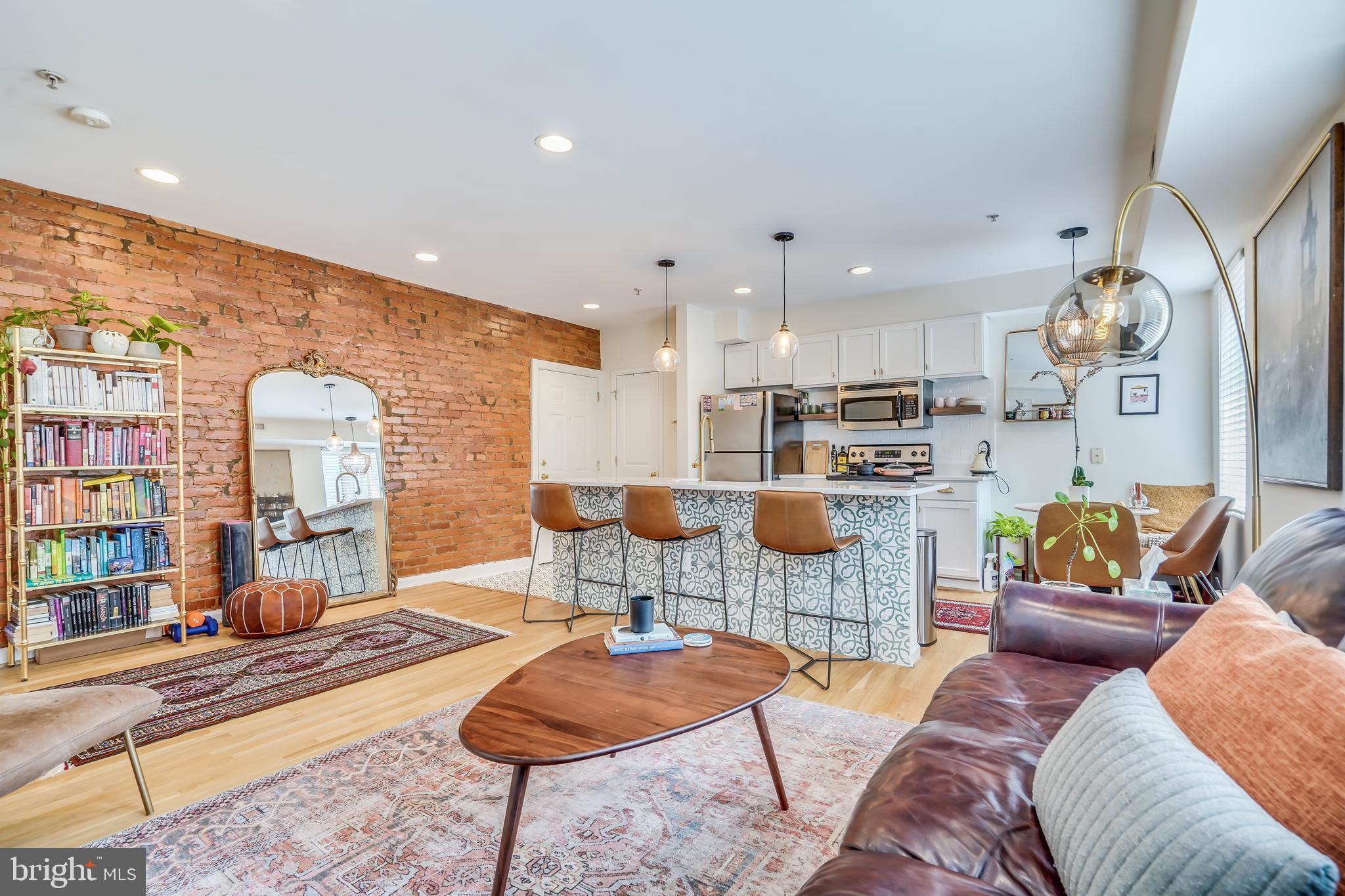 5405 9th Street Northwest, Unit 106 Washington, DC 20011 - Photo 13 of 21 a living room with furniture and a large window