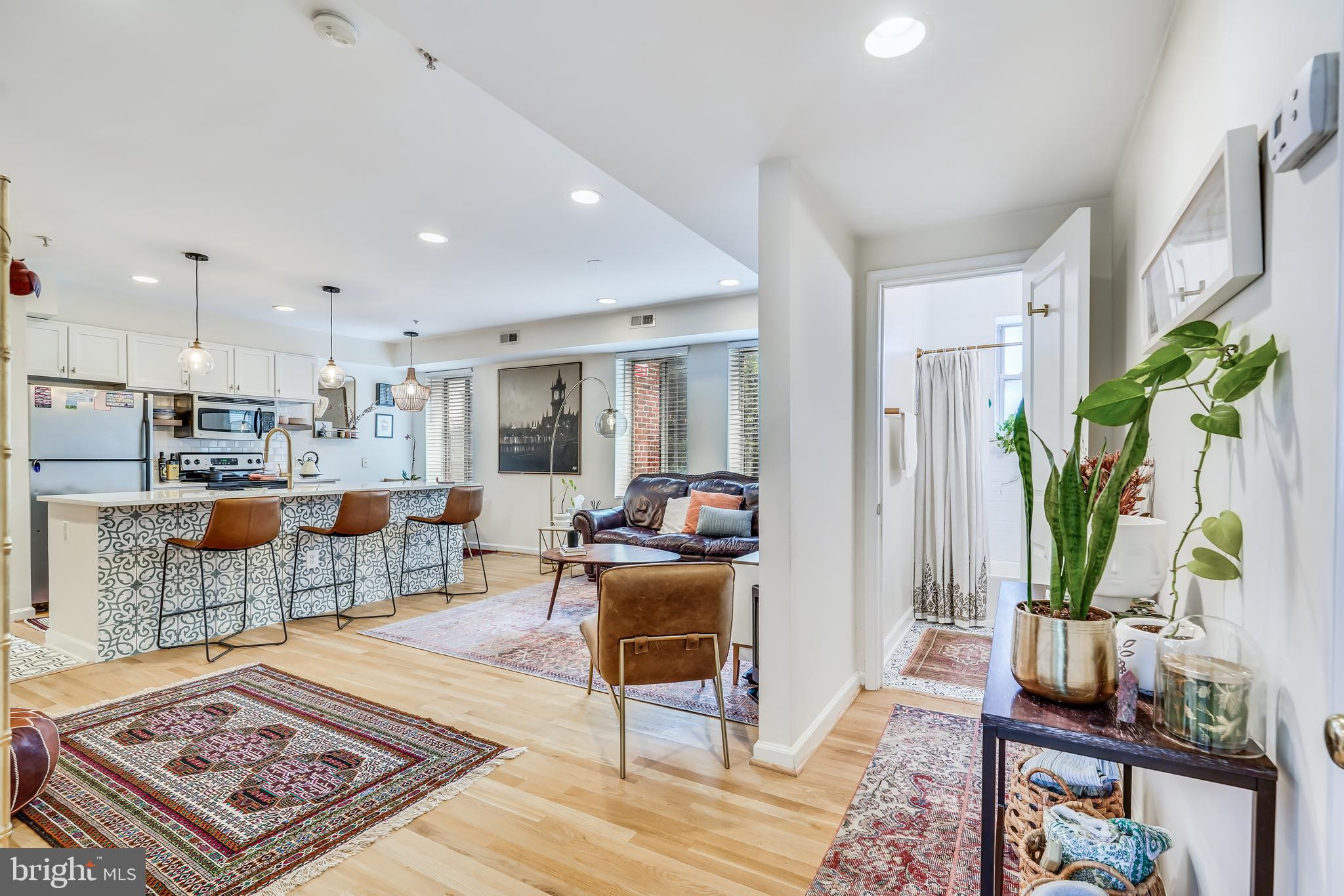 5405 9th Street Northwest, Unit 106 Washington, DC 20011 - Photo 17 of 21 a living room with furniture and a table