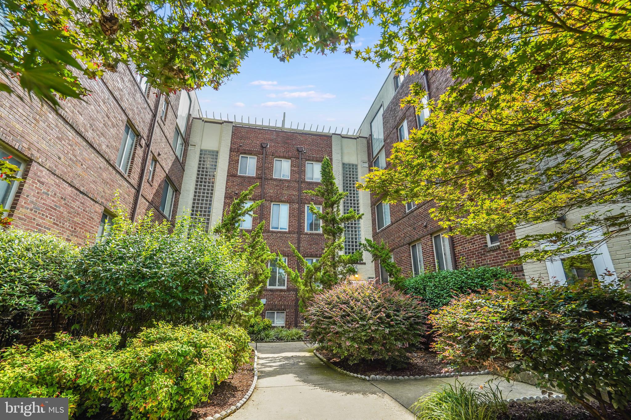 5405 9th Street Northwest, Unit 106 Washington, DC 20011 - Photo 20 of 21 a front view of a residential houses with yard and green space