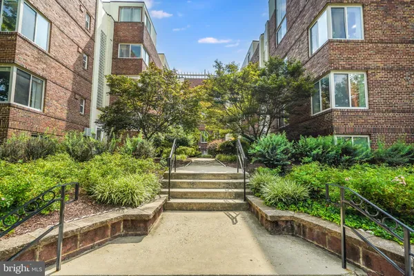 a view of a pathway along the building
