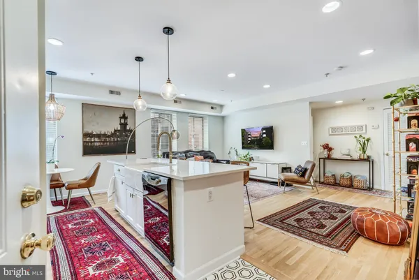 a living room with furniture and a rug
