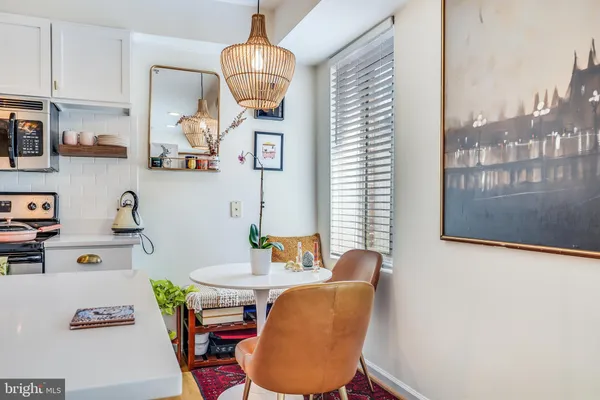 a dining room with furniture and window