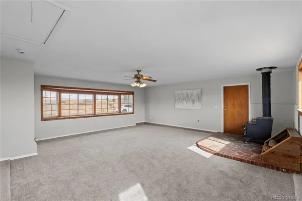a view of a livingroom with a flat screen tv and window