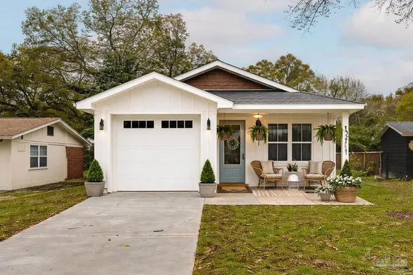 a house view with a sitting space and garden space