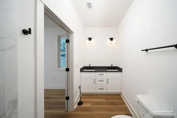 a hallway with washer and dryer