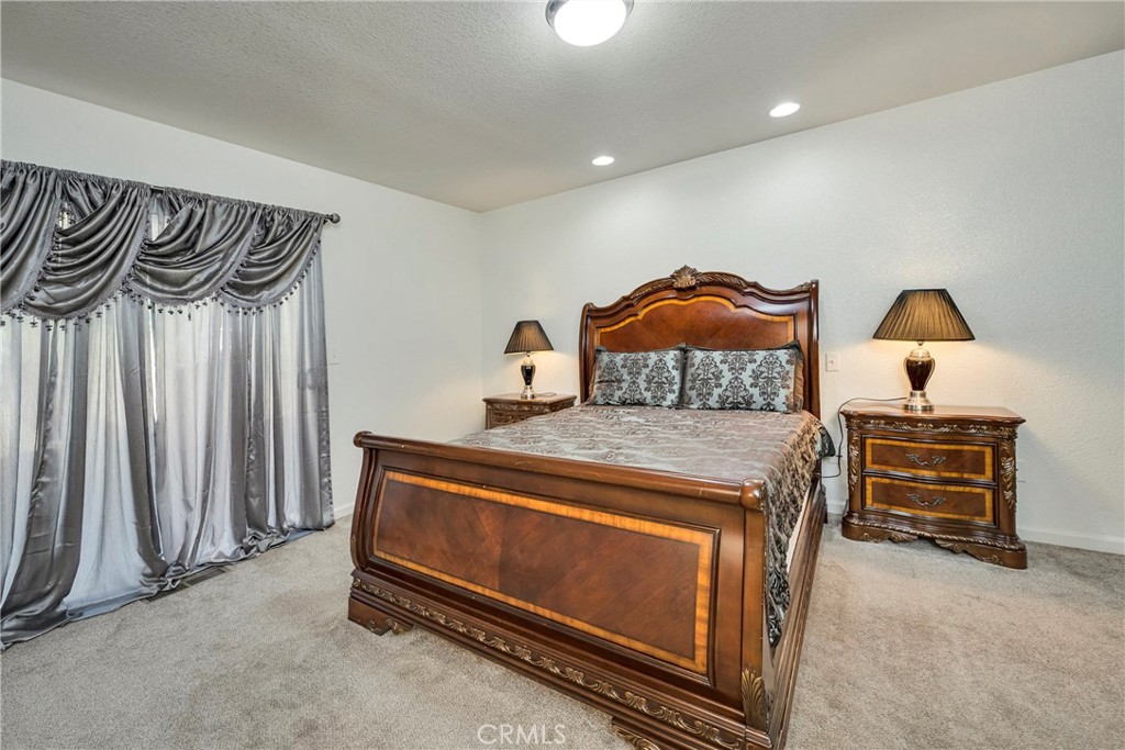 18230 Hidden Valley Road Hidden Valley Lake, CA 95467 - Photo 12 of 22 a bedroom with a bed and a dresser