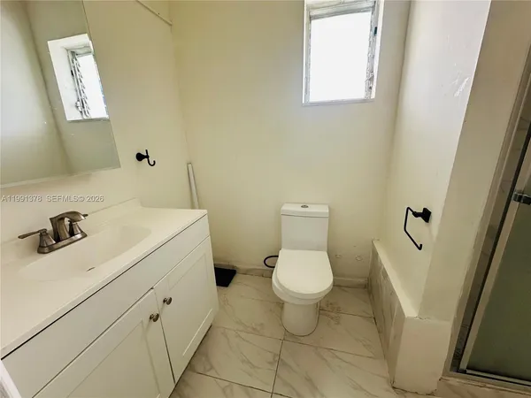 a bathroom with a sink and a toilet