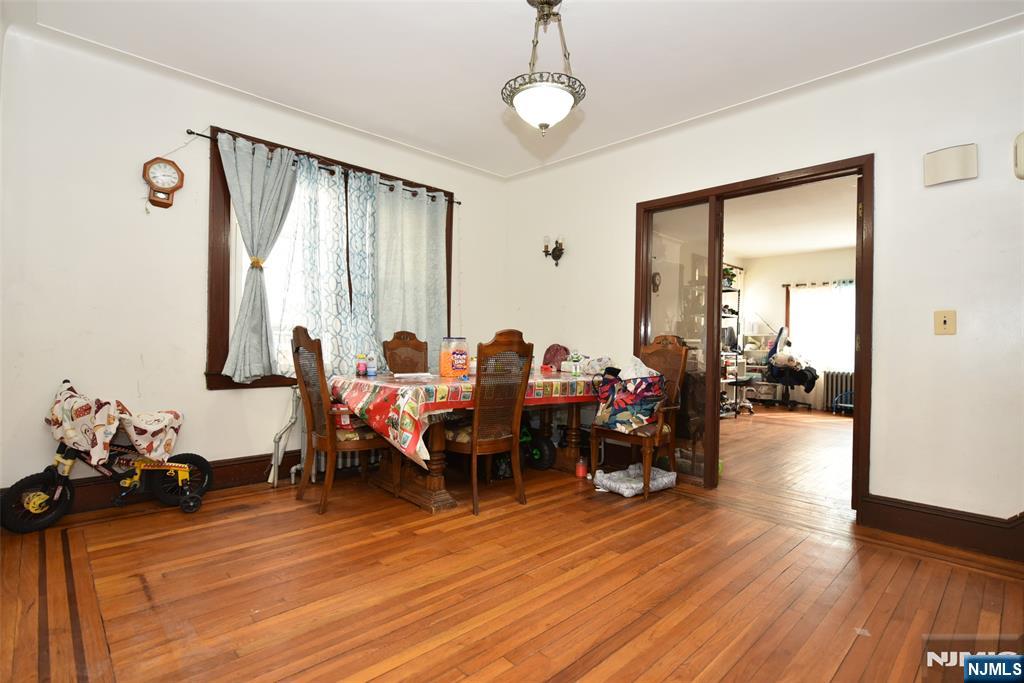 423 North 8th Street Fairview, NJ 07022 - Photo 20 of 30 a living room with furniture and a large window