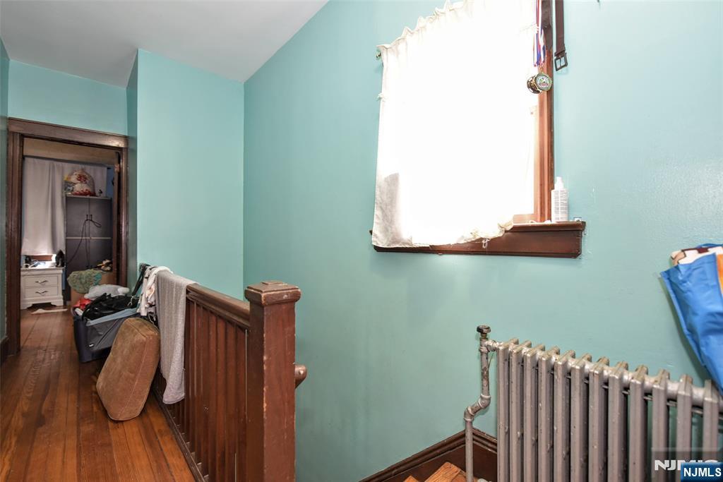423 North 8th Street Fairview, NJ 07022 - Photo 24 of 30 a view of hallway with wooden floor