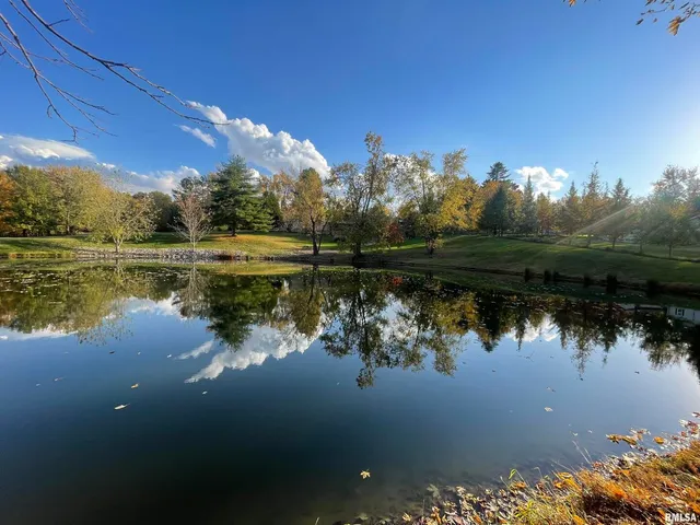 a kitchen with refrigerator and cabinets
