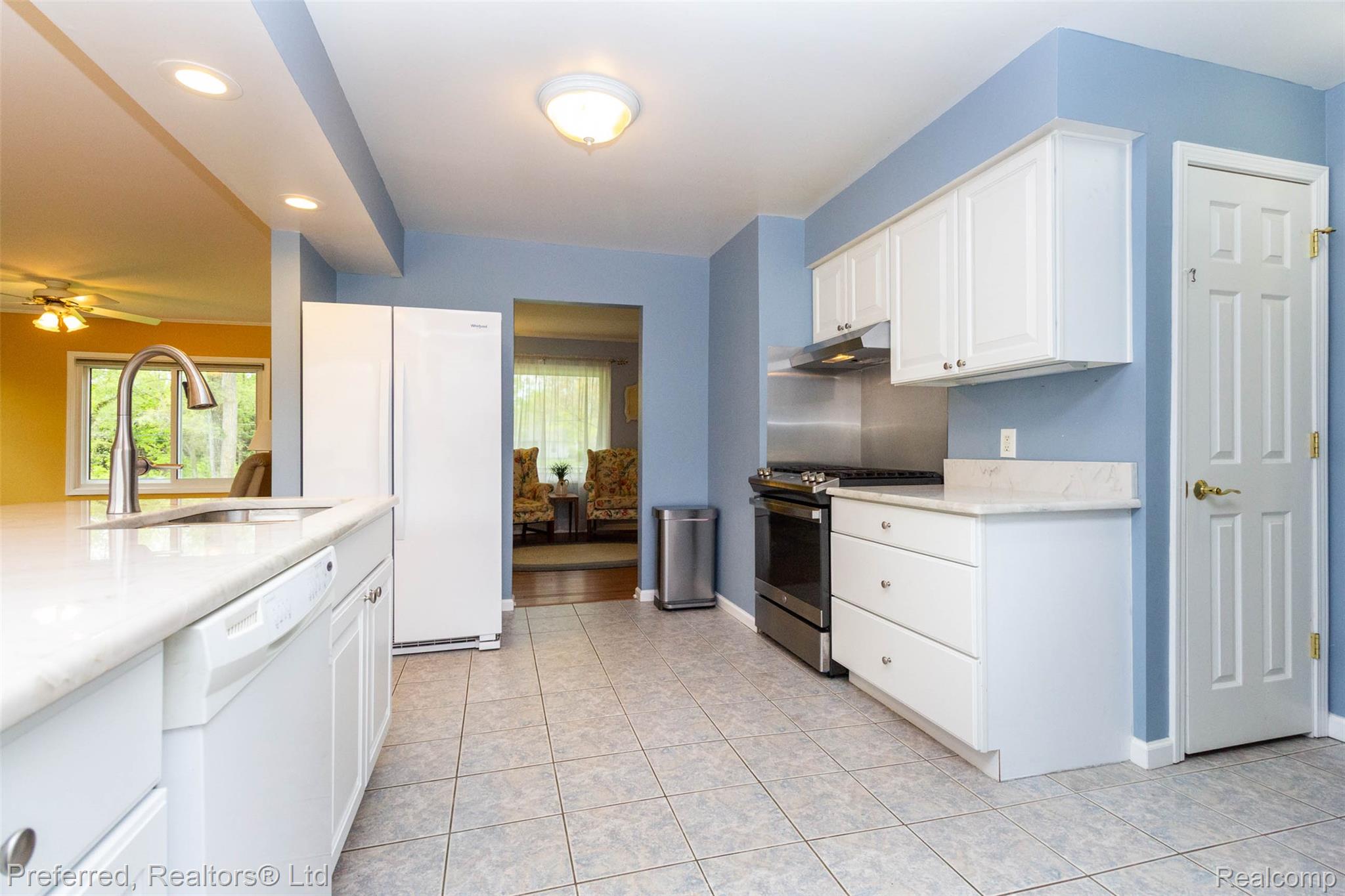 9840 Currie Road Northville, MI 48167 - Photo 17 of 62 Kitchen with white appliances, white cabinetry, ceiling fan, healthy amount of natural light, and recessed lighting