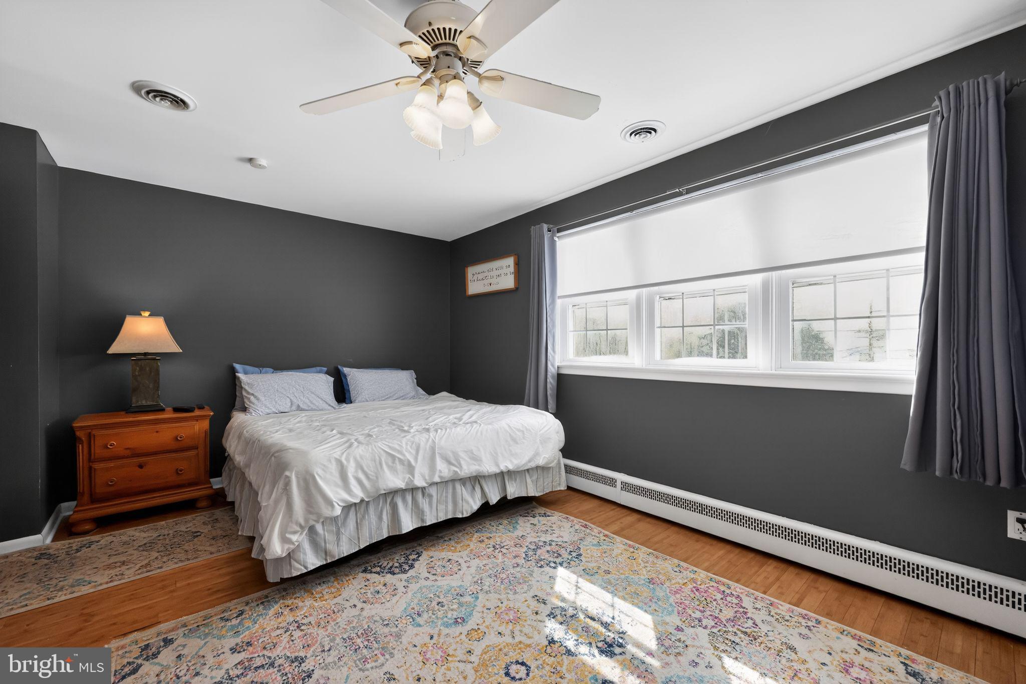 3206 Manor Road Huntingdon Valley, PA 19006 - Photo 16 of 37 a bedroom with a large bed and a window