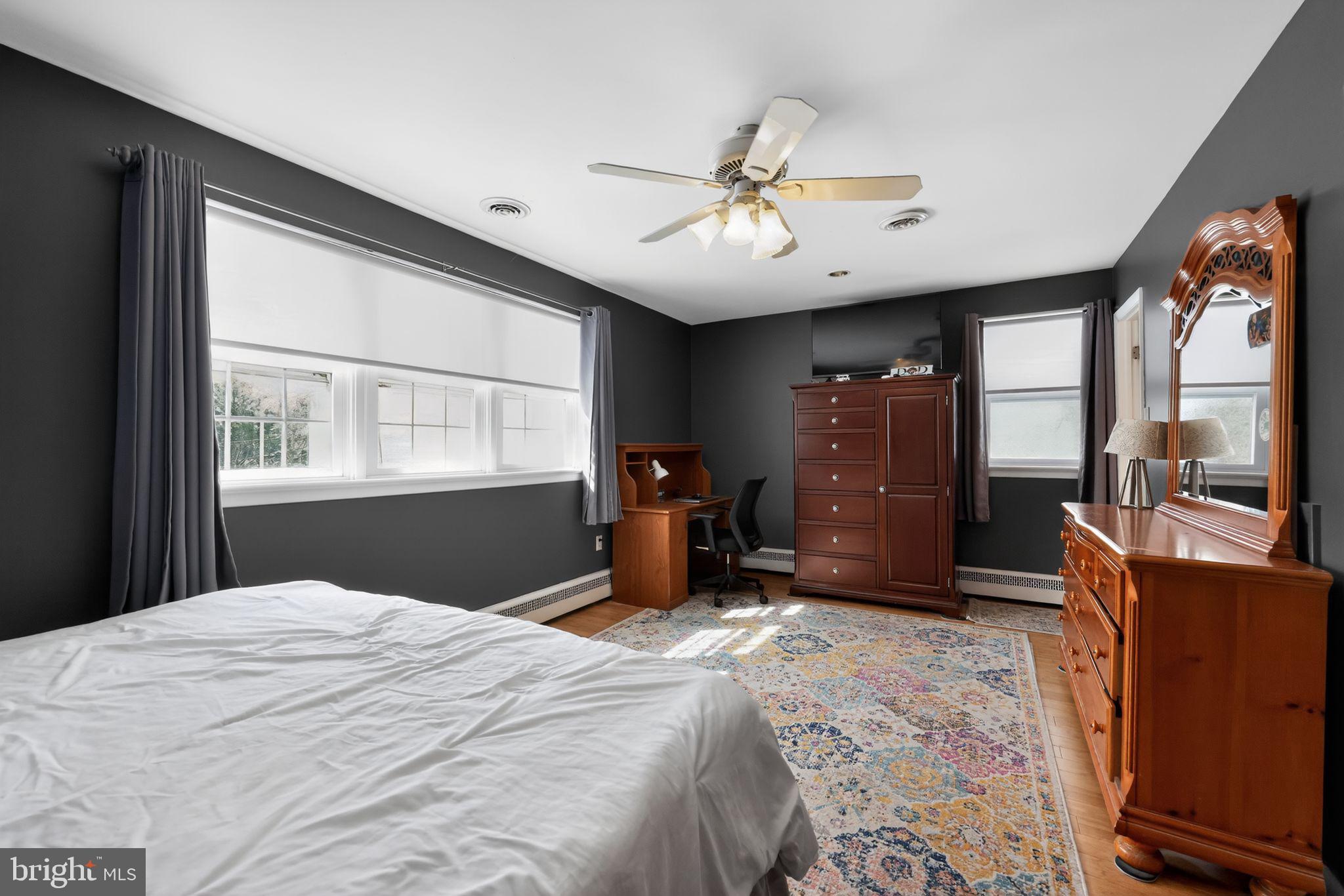 3206 Manor Road Huntingdon Valley, PA 19006 - Photo 17 of 37 a bedroom with a bed dresser and a large window