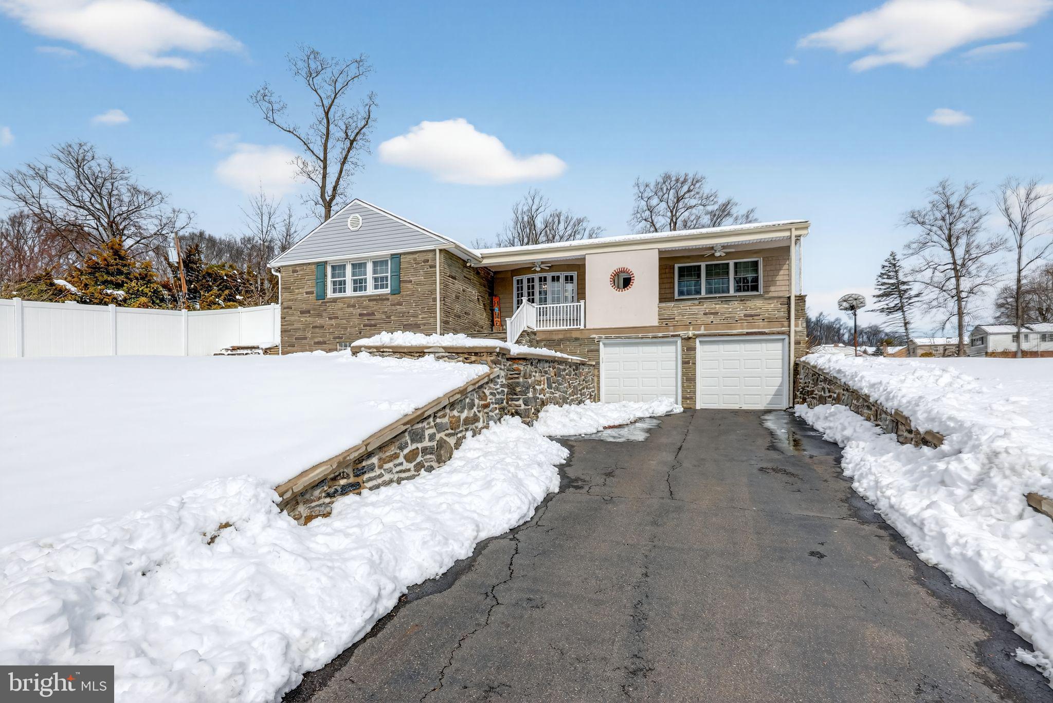 3206 Manor Road Huntingdon Valley, PA 19006 - Photo 2 of 37 a view of a house with a yard covered in snow