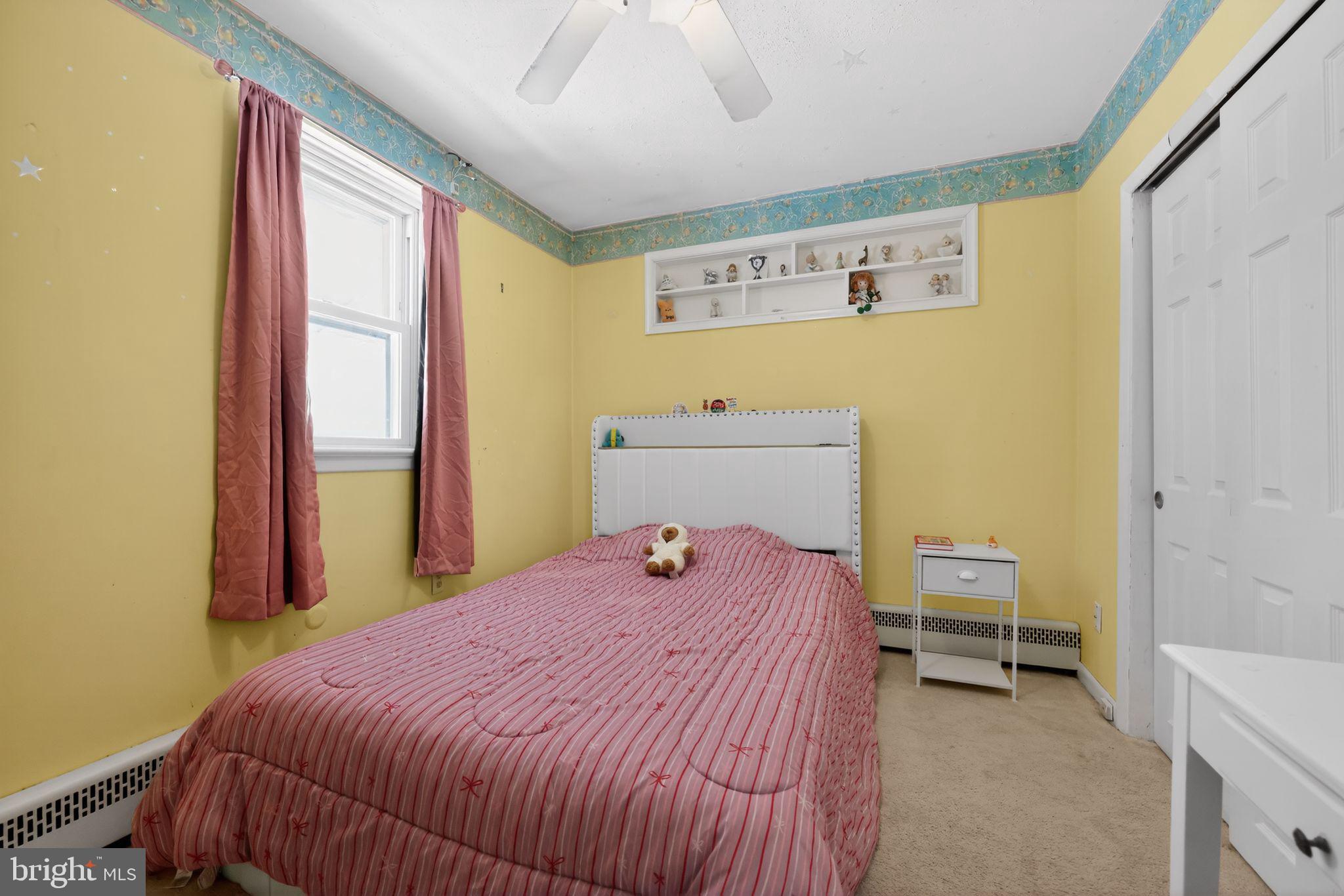 3206 Manor Road Huntingdon Valley, PA 19006 - Photo 22 of 37 a bedroom with a bed and a window