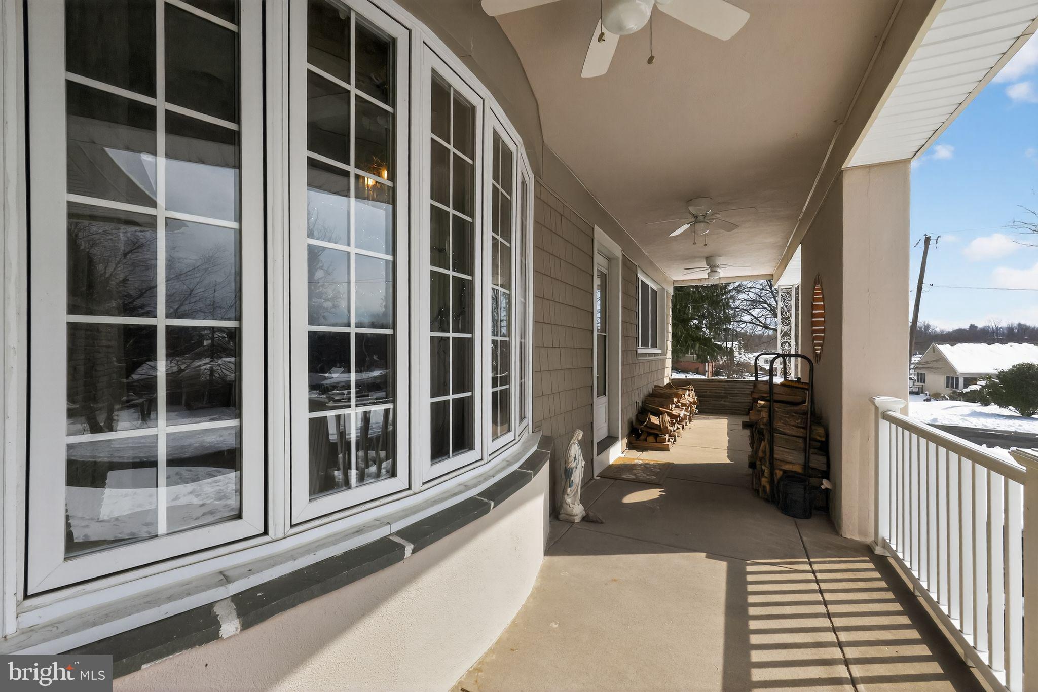 3206 Manor Road Huntingdon Valley, PA 19006 - Photo 6 of 37 a porch with a table and chairs