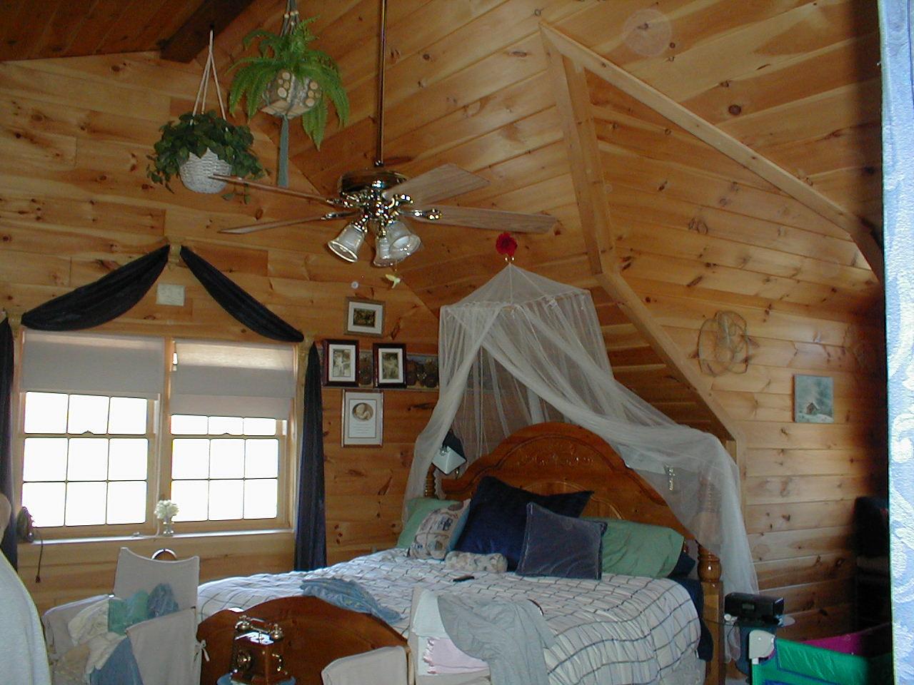 Wiscasset Road Mount Pocono, PA 18344 - Photo 11 of 13 a bedroom with a bed and a chandelier