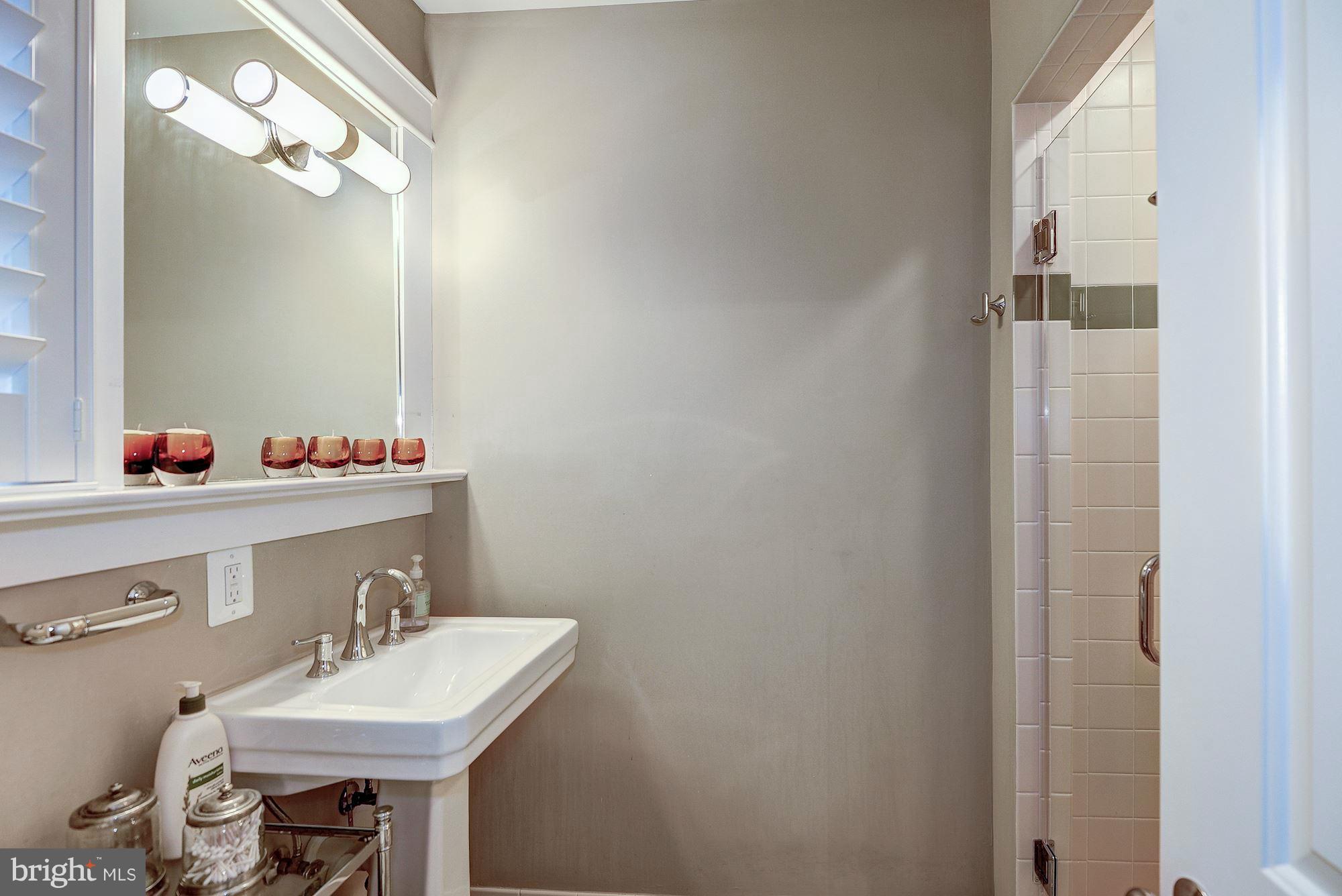 1901 Kirby Road McLean, VA 22101 - Photo 21 of 29 Shower w/glass door, pedestal sink, framed mirror