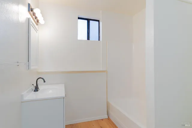 a bathroom with a sink and mirror