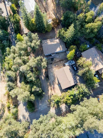 a view of a house with a yard and garage