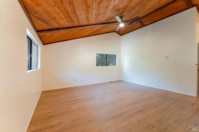 a view of a room with a ceiling fan