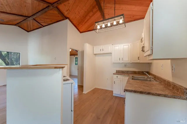 a kitchen with a refrigerator and countertop
